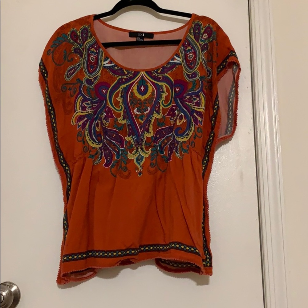 Orange t shirt with elastic synch in middle.